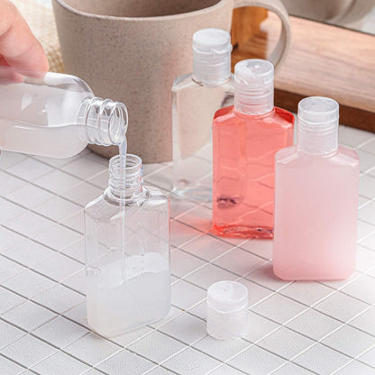 Patelai 50 Pcs Clear Empty Travel Bottles 30 ml/ 1 oz Flip Cap Empty Hand Sanitizer Bottles Container Portable Refillable Flip-top Container for Travel Outdoor Camping Business Trip